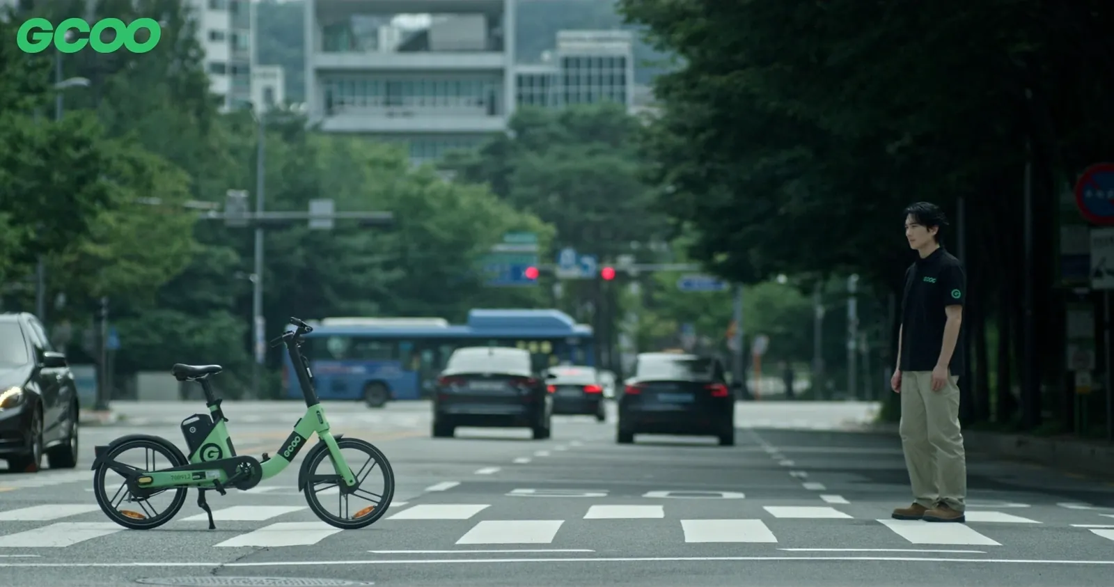 The field operations staffer facing a GCOO bike on a crosswalk