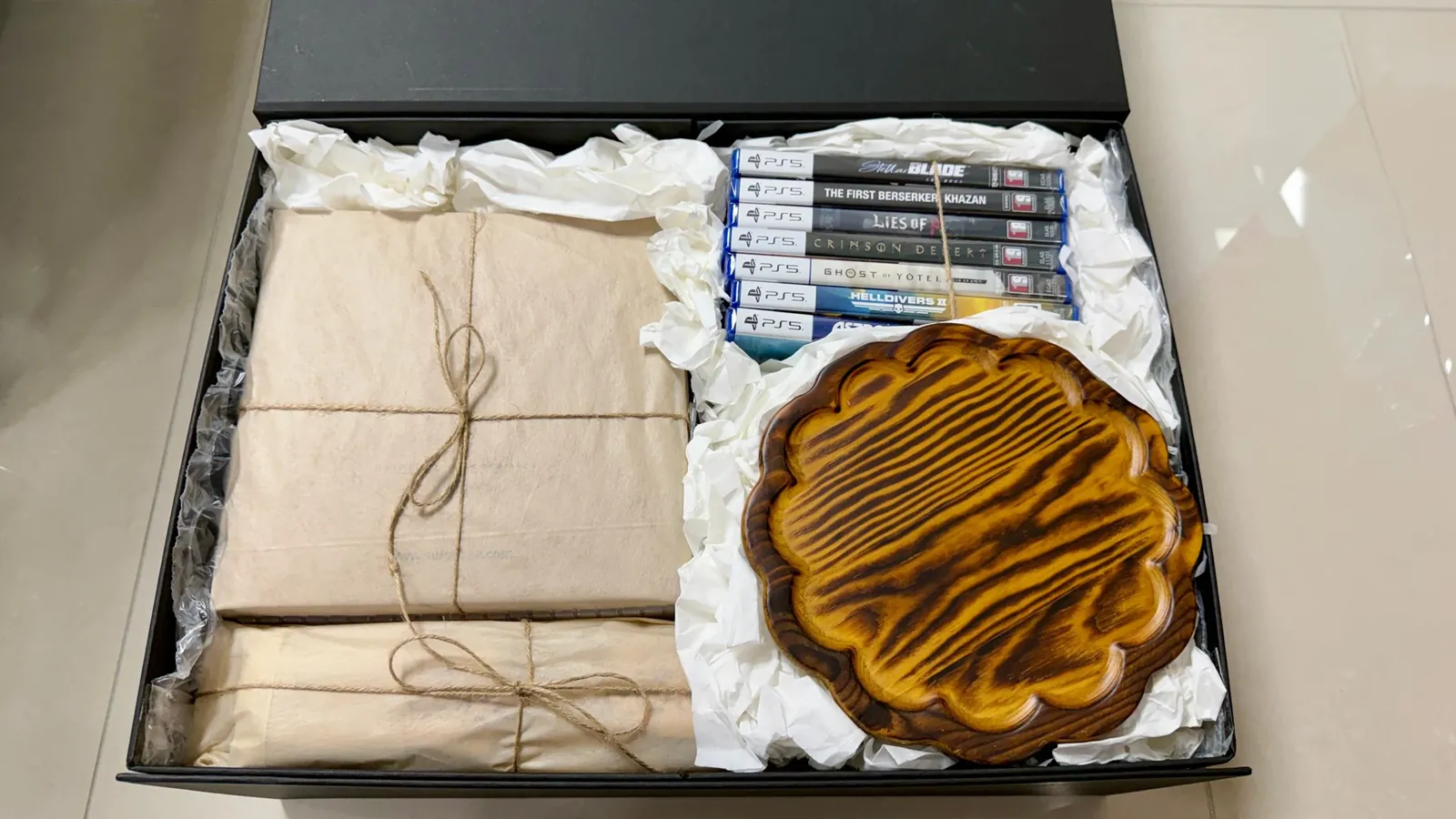 Hanji bundles, seven game titles and a soban table inside the black box