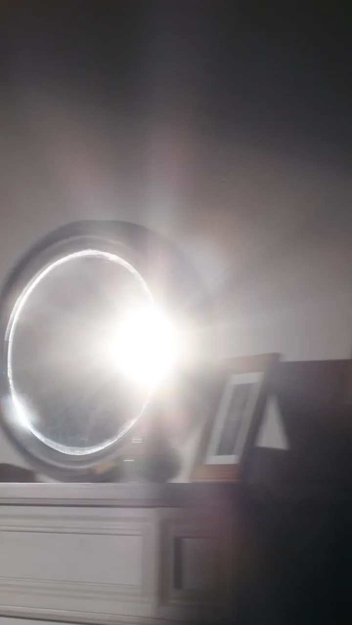 Sunlight reflected into the room by a mirror