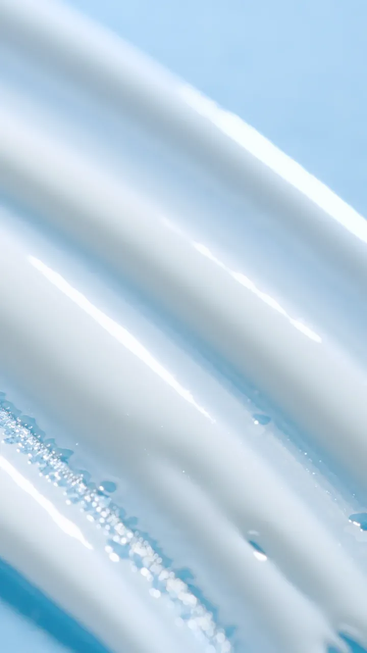 Macro shot of the sun serum texture on a light blue background